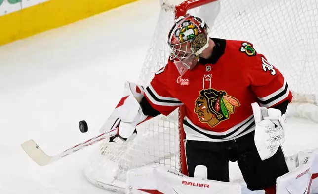Chicago Blackhawks goaltender Spencer Knight defends against the Edmonton Oilers during the second period of an NHL hockey game, Monday, Jan. 12, 2026, in Chicago. (AP Photo/Matt Marton)