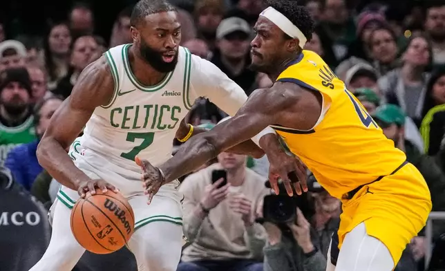 Boston Celtics guard Jaylen Brown (7) drives to the basket against Indiana Pacers forward Pascal Siakam (43) during the first half of an NBA basketball game, Wednesday, Jan. 21, 2026, in Boston. (AP Photo/Charles Krupa)