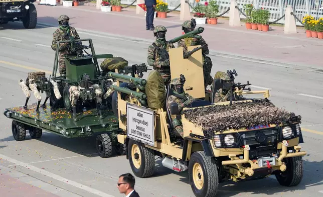 Indian Army soldiers on light strike vehicles drive past during the Republic Day parade celebrations in New Delhi, India, Monday, Jan. 26, 2026. (AP Photo/Manish Swarup)