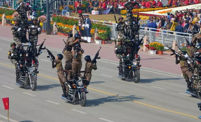 Soldiers from Indian para-military force display their skills on motorcycles during the Republic Day parade celebrations in New Delhi, India, Monday, Jan. 26, 2026. (AP Photo/Manish Swarup)