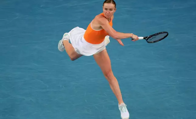 Elina Svitolina of Ukraine plays a forehand return to Aryna Sabalenka of Belarus during their semifinal match at the Australian Open tennis championship in Melbourne, Australia, Thursday, Jan. 29, 2026. (AP Photo/Asanka Brendon Ratnayake)