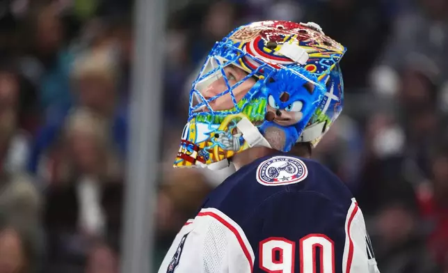 Columbus Blue Jackets goaltender Elvis Merzlikins reacts after giving up a goal to the Colorado Avalanche in the first period of an NHL hockey game Saturday, Jan. 10, 2026, in Denver. (AP Photo/David Zalubowski)