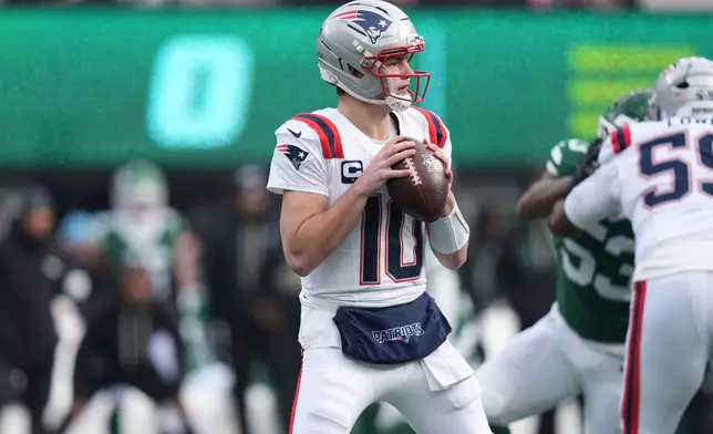 New England Patriots quarterback Drake Maye (10) looks to pass against the New York Jets during the first half of an NFL football game, Sunday, Dec. 28, 2025, in East Rutherford, N.J. (AP Photo/Frank Franklin)