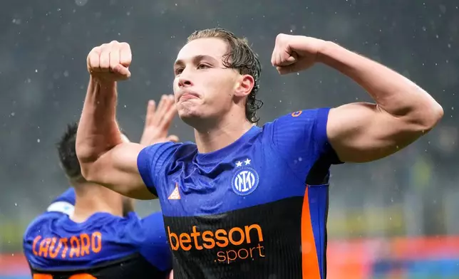 Inter Milan's Francesco Pio Esposito celebrates after scoring his side's third goal during a Serie A soccer match between Inter Milan and Pisa, in Milan, Italy, Friday, Jan. 23, 2026. (AP Photo/Luca Bruno)