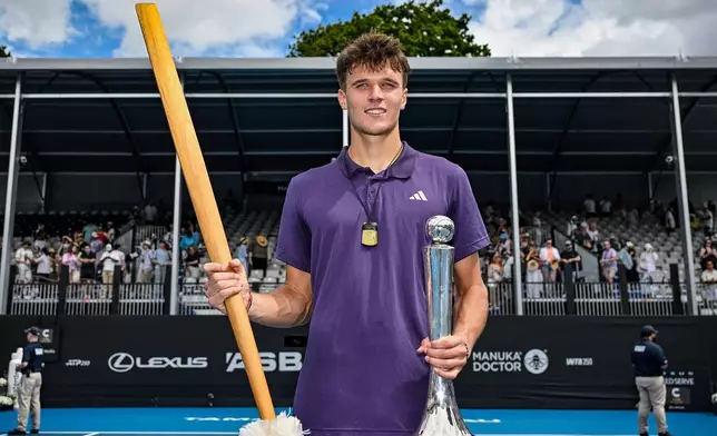 Jakub Mensik of the Czech Republic poses with his trophy after defeating Sebastian Baez of Argentina in the men's singles final of the ASB Classic in Auckland, New Zealand, Saturday, Jan. 17, 2026. (Alan Lee/ Photosport via AP)