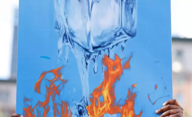 Protesters gather during a demonstration calling for an end to federal immigration enforcement operations and U.S. attacks on Venezuela, Saturday, Jan. 10, 2026, in Los Angeles. (AP Photo/Jill Connelly)