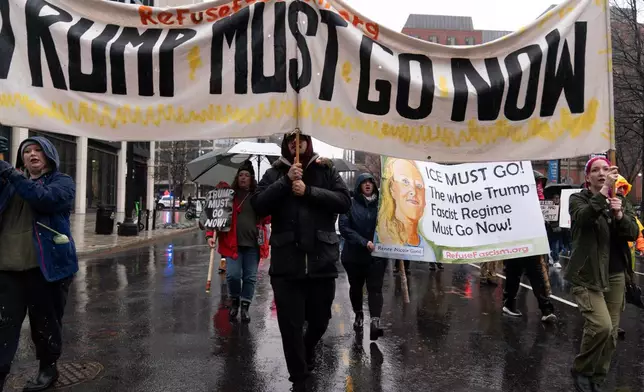 Demonstrators protest outside the White House in Washington, Saturday, Jan. 10, 2026, against the Immigration and Customs Enforcement agent who fatally shot Renee Good in Minneapolis. (AP Photo/Jose Luis Magana)