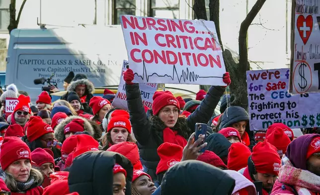 Members of the New York State Nurses Association union picket outside Mount Sinai West Hospital, Tuesday, Jan. 20, 2026, in New York. (AP Photo/Ryan Murphy)