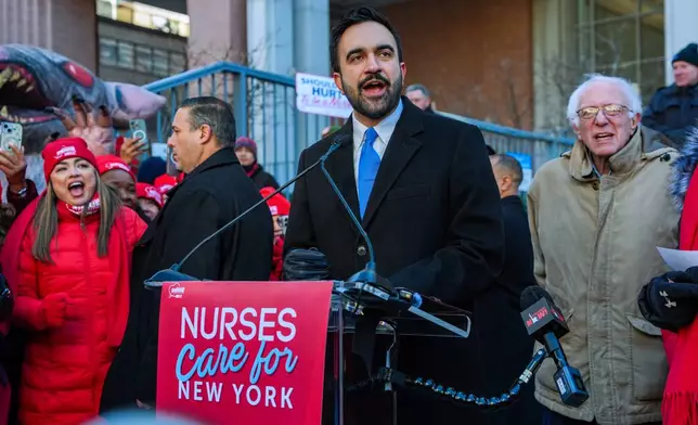 Mayor Zohran Mamdani and Senator Bernie Sanders (I-VT), speak in front of members of the New York State Nurses Association union during a picket outside Mount Sinai West Hospital, Tuesday, Jan. 20, 2026, in New York. (AP Photo/Ryan Murphy)