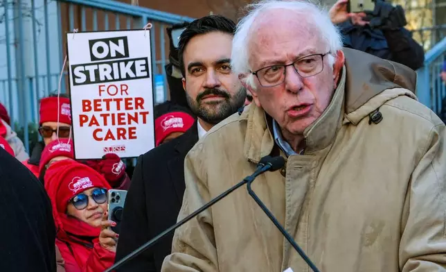 Mayor Zohran Mamdani and Senator Bernie Sanders (I-VT), speak in front of members of the New York State Nurses Association union during a picket outside Mount Sinai West Hospital, Tuesday, Jan. 20, 2026, in New York. (AP Photo/Ryan Murphy)