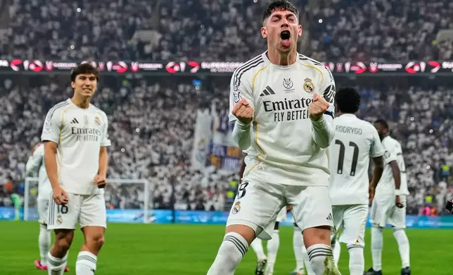 Real Madrid's Federico Valverde, foreground, celebrates after scoring the opening goal during the Spanish Super Cup semifinal soccer match against Atletico Madrid at King Abdullah Sports City Stadium in Jeddah, Saudi Arabia, Thursday, Jan. 8, 2026. (AP Photo/Altaf Qadri)