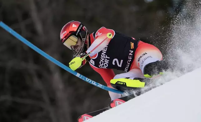 Switzerland's Loic Meillard competes in an alpine ski, men's World Cup slalom, in Wengen, Switzerland, Sunday, Jan. 18, 2026. (AP Photo/Giovanni Zenoni)