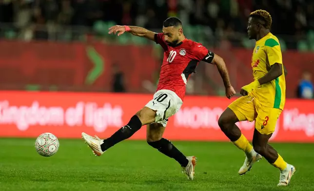 Egypt's Mohamed Salah scores his side's third goal during the Africa Cup of Nations round of 16 soccer match between Egypt and Benin in Agadir, Morocco, Monday, Jan. 5, 2026. (AP Photo/Mosa'ab Elshamy)