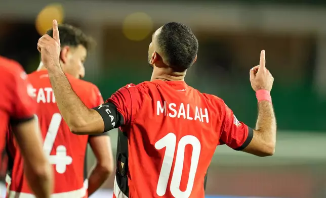 Egypt's Mohamed Salah celebrates after scoring his side's third goal during the Africa Cup of Nations round of 16 soccer match between Egypt and Benin in Agadir, Morocco, Monday, Jan. 5, 2026. (AP Photo/Mosa'ab Elshamy)
