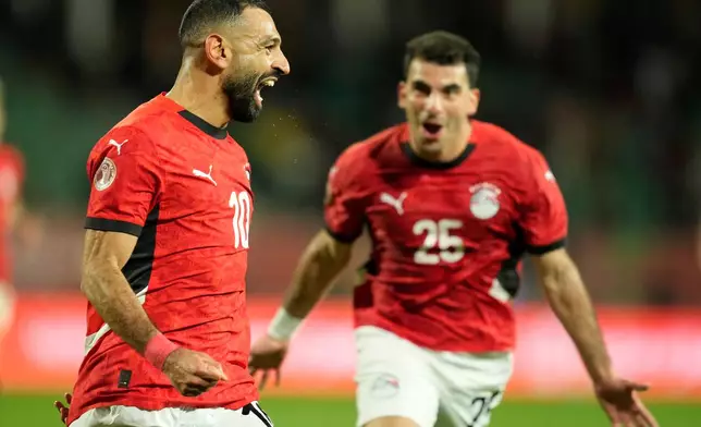 Egypt's Mohamed Salah celebrates after scoring his side's third goal during the Africa Cup of Nations round of 16 soccer match between Egypt and Benin in Agadir, Morocco, Monday, Jan. 5, 2026. (AP Photo/Mosa'ab Elshamy)