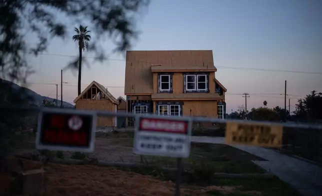 A home being rebuilt is seen, Dec. 3, 2025, in Altadena, Calif., months after the Eaton Fire. (AP Photo/Jae C. Hong)