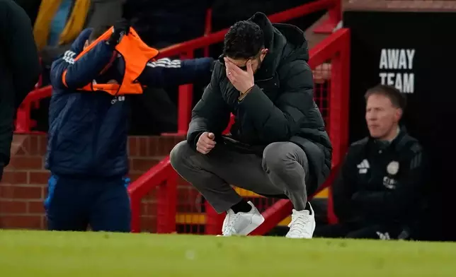FILE - Manchester United's head coach Ruben Amorim reacts after Leicester's Bobby Decordova-Reid scored the opening goal during the English FA Cup fourth round soccer match between Manchester United and Leicester City at the Old Trafford stadium in Manchester, England, Friday, Feb. 7, 2025. (AP Photo/Dave Thompson, file)