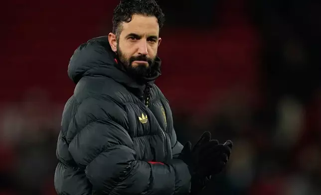 FILE - Manchester United's head coach Ruben Amorim walks on the pitch after the English Premier League soccer match between Manchester United and Wolverhampton Wanderers in Manchester, England, Tuesday, Dec. 30, 2025. (AP Photo/Dave Thompson, file)
