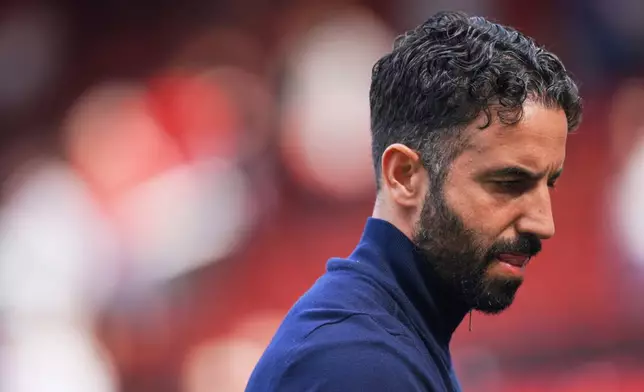 FILE - Manchester United's head coach Ruben Amorim walks on the pitch at the end of the English Premier League soccer match between Manchester United and West Ham at Old Trafford stadium in Manchester, England, Sunday, May 11, 2025. (AP Photo/Ian Hodgson, file)