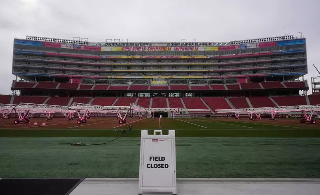 Signs for Super Bowl LX are displayed on the SAP Tower at Levi's Stadium in Santa Clara, Calif., Tuesday, Jan. 20, 2026. (AP Photo/Jeff Chiu)