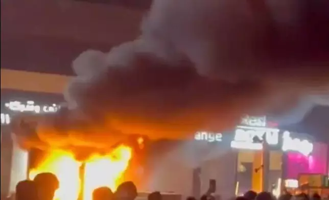 In this frame grab from video taken by an individual not employed by The Associated Press and obtained by the AP outside Iran shows a fire as people protest in Tehran, Iran, Friday, Jan. 9, 2026. (UGC via AP)