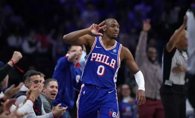 Philadelphia 76ers' Tyrese Maxey reacts after making a basket during the first half of an NBA basketball game against the Sacramento Kings Thursday, Jan. 29, 2026, in Philadelphia. (AP Photo/Matt Slocum)