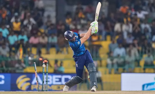 England's Jos Butler is bowled by Sri Lanka's Pramod Madushan during the first ODI cricket match between England and Sri Lanka in Colombo, Sri Lanka, Thursday, Jan. 22, 2026. (AP Photo/Eranga Jayawardena)