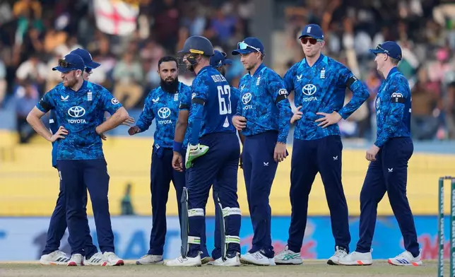 England's Adil Rashid celebrates the wicket of Sri Lanka's Janith Liyanage with teammates during the first ODI cricket match between England and Sri Lanka in Colombo, Sri Lanka, Thursday, Jan. 22, 2026. (AP Photo/Eranga Jayawardena)