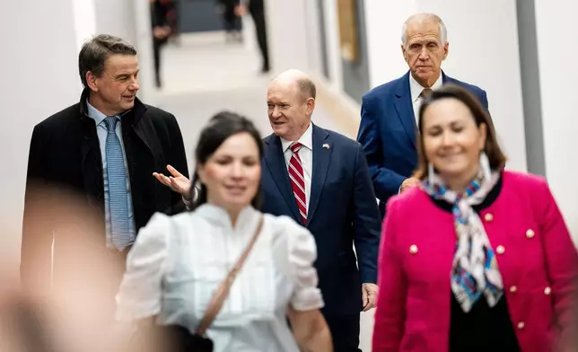 Sen. Chris Coons, D-Del., and Sen. Thom Tillis, R-N.C., arrive as members of the Danish Parliament and a Greenlandic committee meet with American Congress members in the Danish Parliament in Copenhagen, Friday, Jan. 16, 2026. (Ida Marie Odgaard/Ritzau Scanpix via AP)