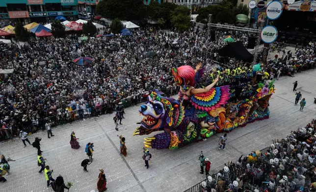 Revelers partake in the Black and White Carnival, recognized by UNESCO as Intangible Cultural Heritage, in Pasto, Colombia, Tuesday, Jan. 6, 2026. (AP Photo/Ivan Valencia)