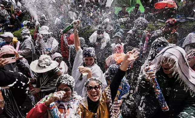 Revelers take part in the Black and White Carnival, recognized by UNESCO as Intangible Cultural Heritage, in Pasto, Colombia, Tuesday, Jan. 6, 2026. (AP Photo/Ivan Valencia)