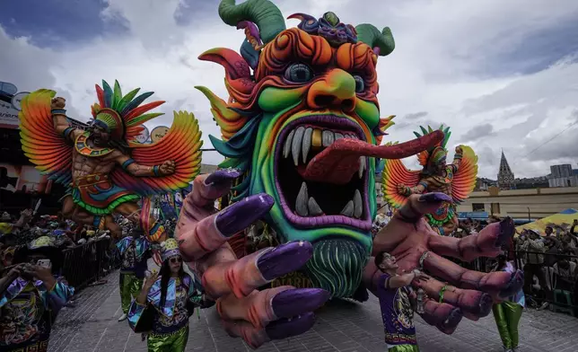Revelers partake in the Black and White Carnival, recognized by UNESCO as Intangible Cultural Heritage, in Pasto, Colombia, Tuesday, Jan. 6, 2026. (AP Photo/Ivan Valencia)