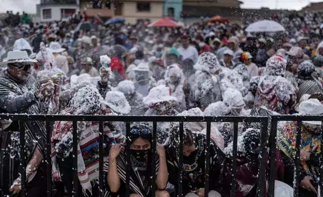 Revelers partake in the Black and White Carnival, recognized by UNESCO as Intangible Cultural Heritage, in Pasto, Colombia, Tuesday, Jan. 6, 2026. (AP Photo/Ivan Valencia)