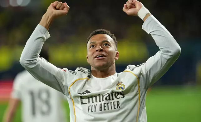 Real Madrid's Kylian Mbappe celebrates after scoring the opening goal during a Spanish La Liga soccer match between Villarreal and Real Madrid in Villarreal, Spain, Saturday, Jan. 24, 2026. (AP Photo/Alberto Saiz)