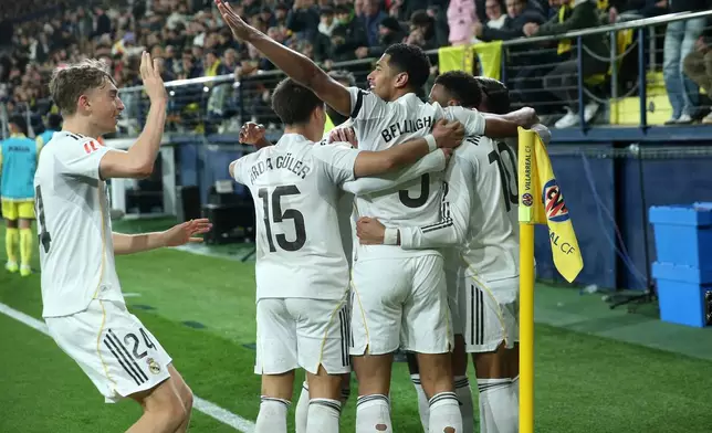 Real Madrid players celebrate after Kylian Mbappe scored the opening goal during a Spanish La Liga soccer match between Villarreal and Real Madrid in Villarreal, Spain, Saturday, Jan. 24, 2026. (AP Photo/Alberto Saiz)