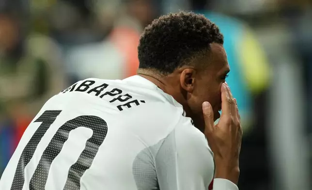 Real Madrid's Kylian Mbappe celebrates after scoring the opening goal during a Spanish La Liga soccer match between Villarreal and Real Madrid in Villarreal, Spain, Saturday, Jan. 24, 2026. (AP Photo/Alberto Saiz)