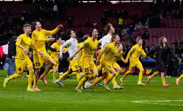 Bodo Glimt players celebrate at the end of the Champions League opening phase soccer match between Atletico Madrid and Bodo Glimt in Madrid, Spain, Wednesday, Jan. 28, 2026. (AP Photo/Manu Fernandez)