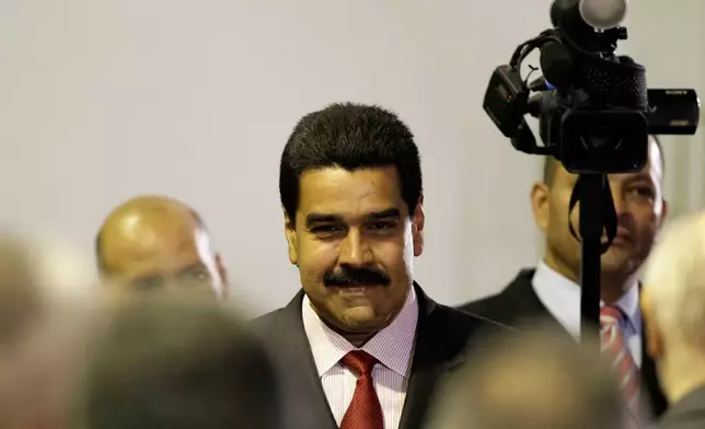 FILE - Venezuela's long time Foreign Minster Nicolas Maduro attends a ceremony declaring President Hugo Chavez official winner of the presidential elections at the Electoral Council in Caracas, Venezuela, Oct. 10, 2012, where Chavez announced he was naming Maduro as his new vice president. (AP Photo/Ariana Cubillos, File)