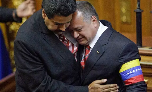 FILE - Nicolas Maduro, left, embraces the President of the National Assembly Diosdado Cabello, after Maduro was sworn in as Venezuela's acting president at the National Assembly in Caracas, Venezuela, March 8, 2013. (AP Photo/Fernando Llano, File)