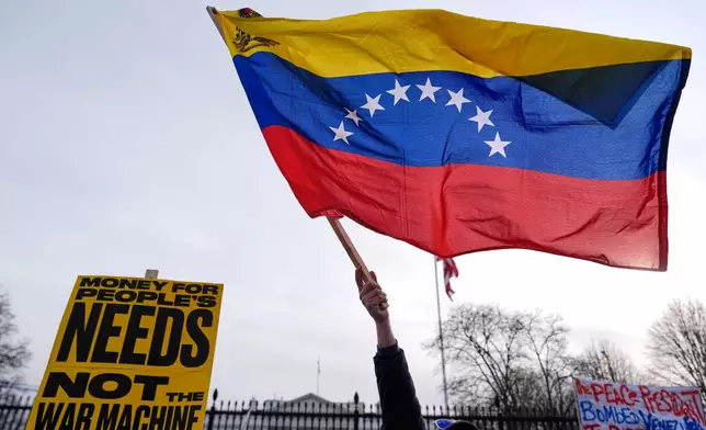 Protesters rally outside the White House Saturday, Jan. 3, 2026, in Washington, after the U.S. captured Venezuelan President Nicolás Maduro and his wife in a military operation. (AP Photo/Julia Demaree Nikhinson)