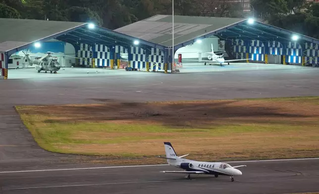 A scorched area is seen at La Carlota airport after explosions and low-flying aircraft were heard in Caracas, Venezuela, Saturday, Jan. 3, 2026. (AP Photo/Matias Delacroix)
