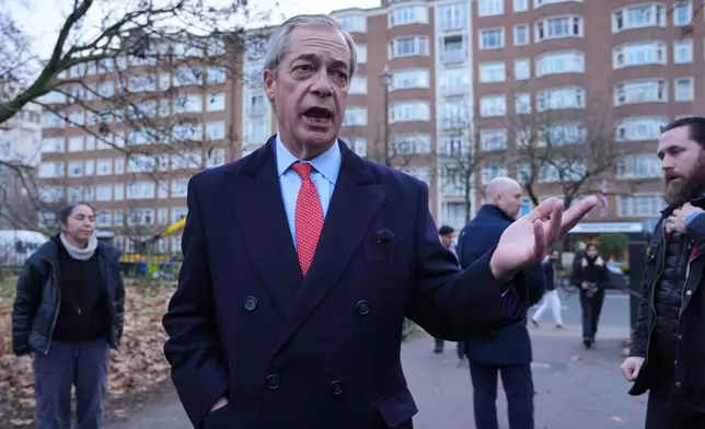 Reform Party leader Nigel Farage addresses protesters outside the Iranian embassy, in London, Monday, Jan. 12, 2026. (Yui Mok/PA via AP)