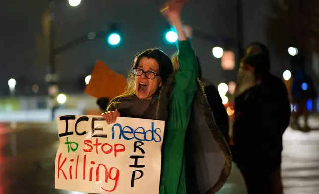 Shellie Rodgers protests during a rally for Renee Good, who was fatally shot by an ICE officer in Minneapolis the day before, Thursday, Jan. 8, 2026, in Kansas City, Mo. (AP Photo/Charlie Riedel)