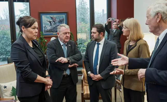 From left, Greenland Foreign Minister Vivian Motzfeldt, Danish Foreign Minister Lars Løkke Rasmussen, Sen. Ruben Gallego, D-Ariz., Sen. Lisa Murkowski, R-Alaska, and Sen. Angus King, I-Maine, begin a meeting on Capitol Hill as officials from Denmark and Greenland meet with lawmakers from the Arctic Caucus, at the Capitol in Washington, Wednesday, Jan. 14, 2026. (AP Photo/J. Scott Applewhite)