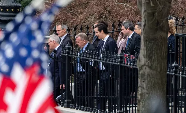 Denmark's Foreign Minister Lars Løkke Rasmussen, third from left, Greenland's Foreign Minister Vivian Motzfeldt, not shown, and their delegations leave the Old Eisenhower Executive Office Building on the grounds of the White House, Wednesday, Jan. 14, 2026, in Washington. (AP Photo/Alex Brandon)