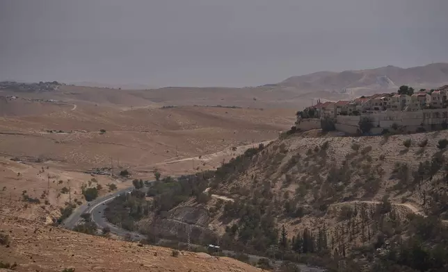 FILE - View of an area near Maale Adumim in the Israeli-occupied West Bank, where Israeli Finance Minister Bezalel Smotrich says housing units will be built as part of the E1 settlement project, Aug. 14, 2025. (AP Photo/Ohad Zwigenberg, File)