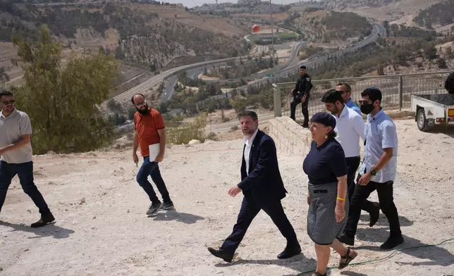 FILE - Israeli Finance Minister Bezalel Smotrich arrives for a press conference about new settlement construction in the Israel-occupied West Bank near Maale Adumim, Aug. 14, 2025. (AP Photo/Ohad Zwigenberg, File)