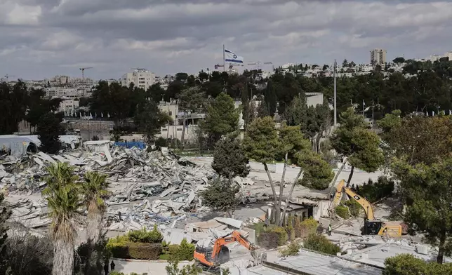 Israeli bulldozers demolish a UNRWA compound, belonging to the U.N. agency that assists Palestinian refugees, in east Jerusalem Tuesday, Jan. 20, 2026. (AP Photo/Mahmoud Illean)