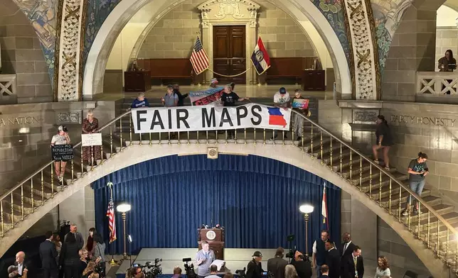 FILE - Opponents of Missouri's Republican-backed congressional redistricting plan display a banner in protest at the State Capitol in Jefferson City, Missouri, Sept. 10, 2025. (AP Photo/David A. Lieb, File)
