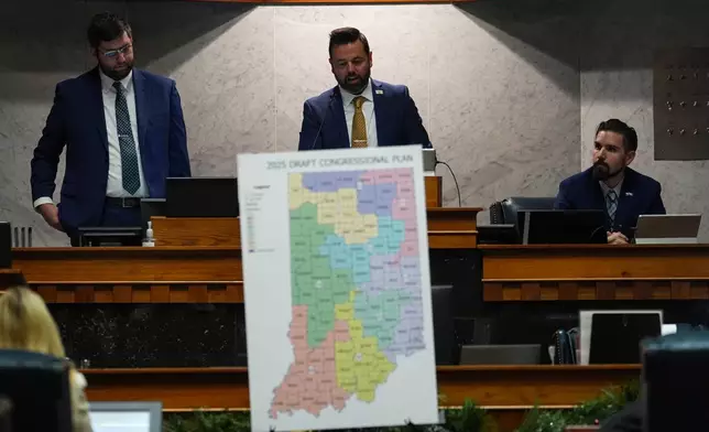 FILE - ndiana Lt. Gov. Micah Beckwith announces the results of a vote to redistrict the state's congressional map, Dec. 11, 2025, at the Statehouse in Indianapolis. (AP Photo/Michael Conroy, File)